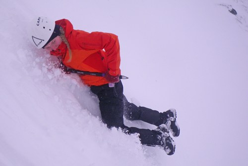 Using an ice-axe to halt a slide on a snowy slope Using an ice-axe to halt a slide on a snowy slope