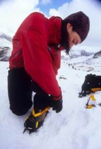 Fitting a crampon c.Alex Messenger Fitting a crampon c.Alex Messenger